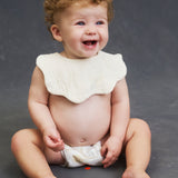 Infant sitting up in Lovekins TriplePro Bio nappy