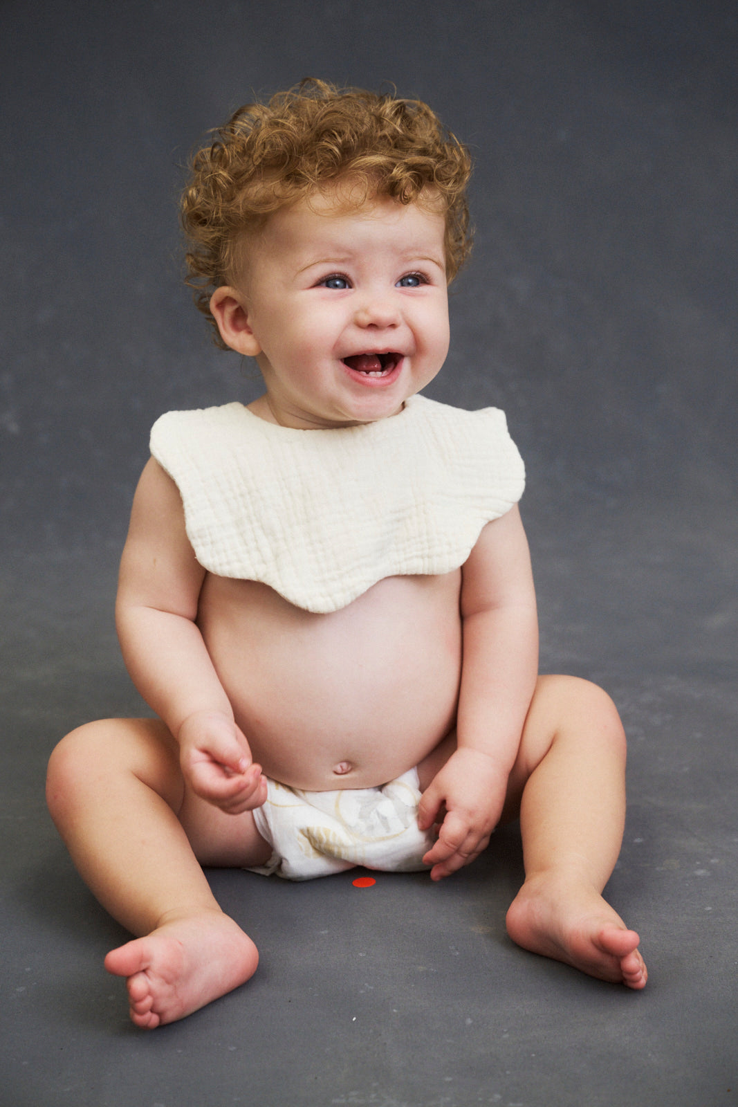 Infant sitting up in Lovekins TriplePro Bio nappy